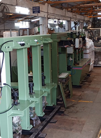 Row of industrial packaging and automation machines positioned on a factory floor, ready for assembly, testing, or dispatch inside the Electronics Devices manufacturing facility.