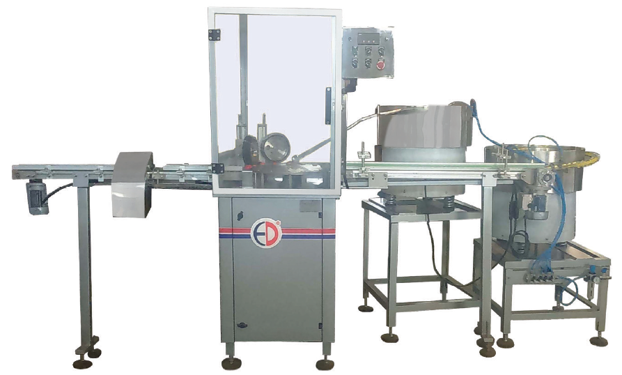 Automated cap assembly machine with conveyor system, cap feeding unit, and enclosed assembly station designed for continuous closure assembly operations.