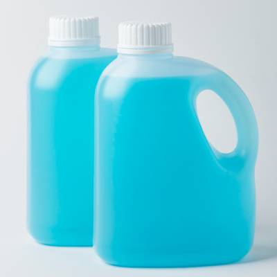 Two HDPE plastic containers filled with blue liquid, featuring white screw-cap closures. One container includes an integrated handle for easy carrying and pouring, commonly used for detergents, cleaning chemicals, and industrial liquid products.