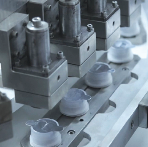 TwinPort sealing and inspection system performing automated sealing and quality inspection of plastic dispensing closures on a production line.