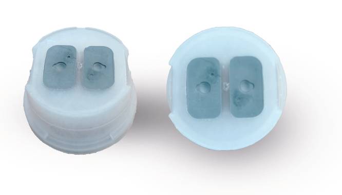 TwinPort dispensing cap with dual-port sealing system designed for controlled dispensing and product protection.