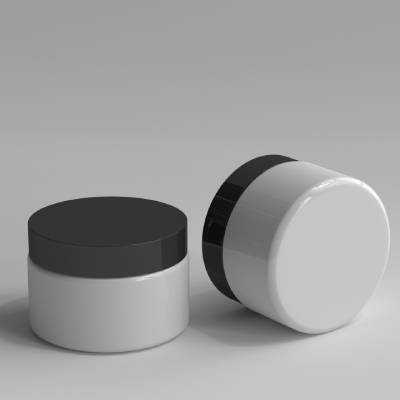 White cosmetic jars with black screw-cap lids used for creams, balms, and personal care products.